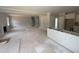 Spacious living room flowing into the kitchen area, awaiting customization, with ample natural light at 145 Tee Dr, Selma, NC 27576