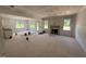 Spacious living room under construction, featuring a fireplace and ample natural light at 145 Tee Dr, Selma, NC 27576