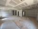 Spacious living room with fresh drywall, awaiting your personal touch and design at 145 Tee Dr, Selma, NC 27576