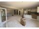 Open-concept living area with kitchen featuring granite countertops, perfect for entertaining at 145 Tee Dr, Selma, NC 27576