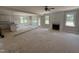 Open living area with fireplace, abundant natural light, and view into the kitchen at 145 Tee Dr, Selma, NC 27576