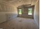 Main bedroom under construction, featuring large windows and ample natural light at 145 Tee Dr, Selma, NC 27576