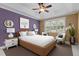 Spacious bedroom boasts a tray ceiling, ceiling fan, natural lighting, and ample space at 1614 E Hardscrabble Dr, Hillsborough, NC 27278