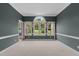 Inviting living area featuring neutral paint, plush carpeting, and large windows for natural light at 1614 E Hardscrabble Dr, Hillsborough, NC 27278