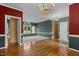 Open-concept living space showcasing natural light, hardwood floors, and neutral paint colors at 1614 E Hardscrabble Dr, Hillsborough, NC 27278