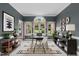 Bright office space with natural light, built-in shelving, stylish decor, and a neutral color palette at 1614 E Hardscrabble Dr, Hillsborough, NC 27278