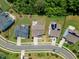 Birds-eye view of the neighborhood with well-manicured lawns and mature trees at 1716 Aberdour Dr, Apex, NC 27502
