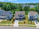 Aerial view of a well-maintained neighborhood with lush greenery and blue skies at 1716 Aberdour Dr, Apex, NC 27502