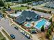 Community clubhouse with pools, lounge area, and playground for Gathering fun at 1716 Aberdour Dr, Apex, NC 27502