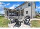 A stone fire pit and chairs are the focal point of this inviting backyard retreat at 1716 Aberdour Dr, Apex, NC 27502