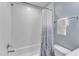The bathroom features a white bathtub and toilet with a shower and tiled walls at 1716 Aberdour Dr, Apex, NC 27502