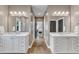 Bathroom with double vanity, tile floors, and view to bedroom at 1716 Aberdour Dr, Apex, NC 27502