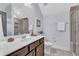 Updated bathroom features a single sink vanity, shower with glass door, and tile flooring at 1716 Aberdour Dr, Apex, NC 27502