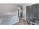 This bedroom includes neutral walls, a closet and a comfortable bed with a work space at 1716 Aberdour Dr, Apex, NC 27502
