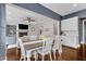 Bright and open dining room with living room and kitchen views with stylish decor and ample seating at 1716 Aberdour Dr, Apex, NC 27502