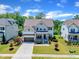 Charming two-story home features a welcoming front porch and manicured lawn at 1716 Aberdour Dr, Apex, NC 27502