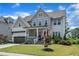 Inviting two-story home with a well-kept lawn, tasteful landscaping, and a welcoming front porch at 1716 Aberdour Dr, Apex, NC 27502