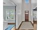 Elegant foyer featuring hardwood floors, a grand doorway, and high ceilings at 1716 Aberdour Dr, Apex, NC 27502