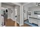 Hallway leading to office and bedroom with hardwood floors and neutral walls at 1716 Aberdour Dr, Apex, NC 27502
