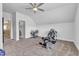 Large, well-lit home gym with ample space for equipment and multiple machines for a complete workout at 1716 Aberdour Dr, Apex, NC 27502