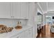 Stylish kitchen featuring quartz countertops, white subway tile backsplash, and open to the living space at 1716 Aberdour Dr, Apex, NC 27502