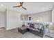 Comfortable loft space features a sectional couch, ceiling fan, and neutral decor at 1716 Aberdour Dr, Apex, NC 27502