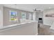 Bright loft area with large windows and a cozy seating area at 1716 Aberdour Dr, Apex, NC 27502