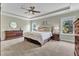 Spacious main bedroom with tray ceiling, natural light, and neutral color palette at 1716 Aberdour Dr, Apex, NC 27502