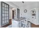 Cozy home office with vintage-style desk, bookcase, and adjacent glass doors at 1716 Aberdour Dr, Apex, NC 27502