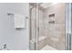 Modern tiled shower with a glass door, built-in seat, and convenient toiletry niche at 1716 Aberdour Dr, Apex, NC 27502