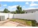 Fenced backyard featuring a small lawn, brick edging and an air conditioning unit at 1966 Grassy Banks Dr, Raleigh, NC 27610