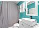 Stylish bathroom featuring modern vanity, sink and a gray patterned shower curtain at 1966 Grassy Banks Dr, Raleigh, NC 27610