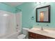 A bathroom with a shower-tub combo, a toilet, and a wood-toned sink cabinet with a mirror at 1966 Grassy Banks Dr, Raleigh, NC 27610