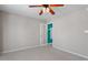Bedroom with ceiling fan, plush carpeting, and a closet with privacy curtains at 1966 Grassy Banks Dr, Raleigh, NC 27610