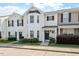 Inviting townhouse featuring a well-manicured lawn and neutral siding, creating a cozy curb appeal at 1966 Grassy Banks Dr, Raleigh, NC 27610