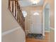Welcoming foyer with hardwood floors, a staircase, and natural light at 1966 Grassy Banks Dr, Raleigh, NC 27610