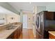 Kitchen with stainless steel sink, wooden cabinets, and a stainless steel refrigerator at 1966 Grassy Banks Dr, Raleigh, NC 27610