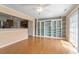 Open-concept living room with hardwood floors, built-ins, and ample natural light at 1966 Grassy Banks Dr, Raleigh, NC 27610