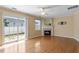 Cozy living room with a fireplace, sliding doors to the backyard, and hardwood floors at 1966 Grassy Banks Dr, Raleigh, NC 27610