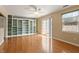 Bright living room featuring hardwood floors, custom built-ins, and a sliding glass door at 1966 Grassy Banks Dr, Raleigh, NC 27610