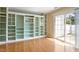Inviting living room featuring custom built-in shelving and sliding glass door access at 1966 Grassy Banks Dr, Raleigh, NC 27610