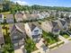 Aerial view of the home surrounded by mature trees and neighborhood homes at 2036 October Dr, Durham, NC 27703