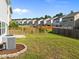 Well-maintained backyard featuring a wood fence and lush green grass at 2036 October Dr, Durham, NC 27703
