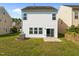 Fenced backyard with well maintained lawn and exterior patio entrance at 2036 October Dr, Durham, NC 27703