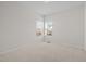 Bedroom features carpet, a window and neutral walls at 2036 October Dr, Durham, NC 27703