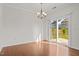 Bright dining room featuring hardwood floors, a modern chandelier, and sliding glass doors to the backyard at 2036 October Dr, Durham, NC 27703