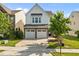 Charming two-story home featuring a stone-accented facade and a convenient two-car garage at 2036 October Dr, Durham, NC 27703