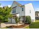 Charming home with a two-car garage, stone accents, and manicured landscaping at 2036 October Dr, Durham, NC 27703
