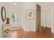 Welcoming foyer with hardwood floors, neutral walls, and a view into an adjacent room at 2036 October Dr, Durham, NC 27703