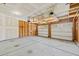 Spacious two-car garage with concrete flooring and overhead storage at 2036 October Dr, Durham, NC 27703